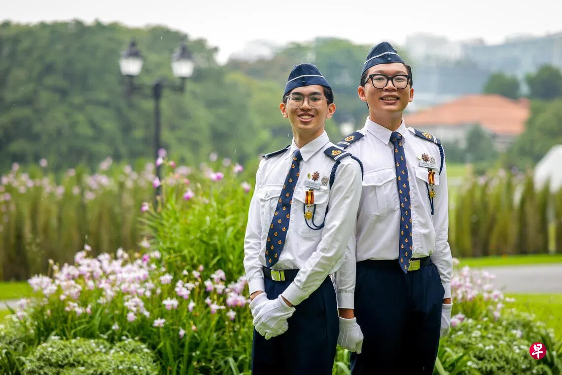 Nicholas Koh (right) with fellow Boys Brigade member in uniform.