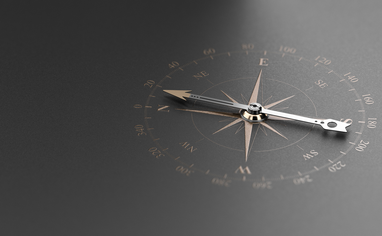 Compass against black background