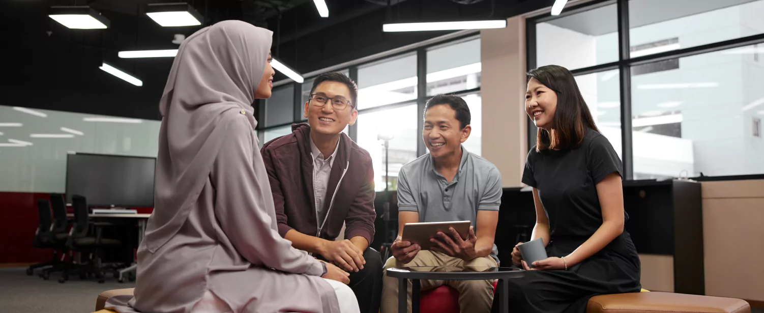 Four colleagues in discussion