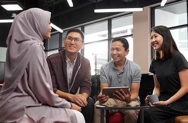 Four colleagues in discussion