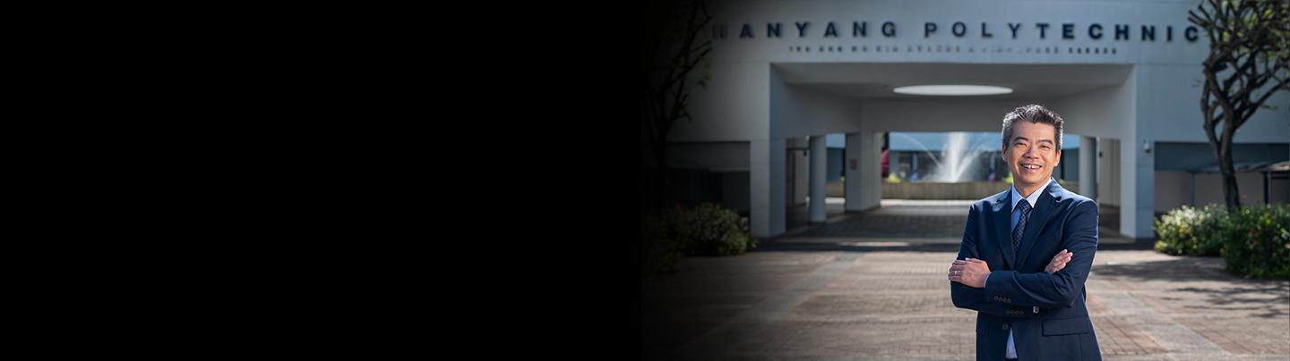 Mr Russell Chan, PCEO, Nanyang Polytechnic, standing in front of the NYP school campus.