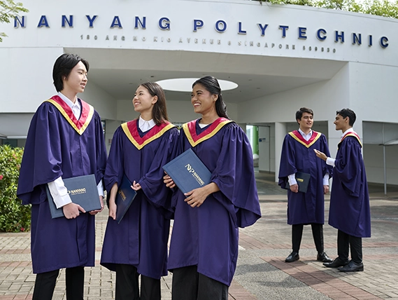 NYP Graduands standing in front of the Nanyang Polytechnic Campus