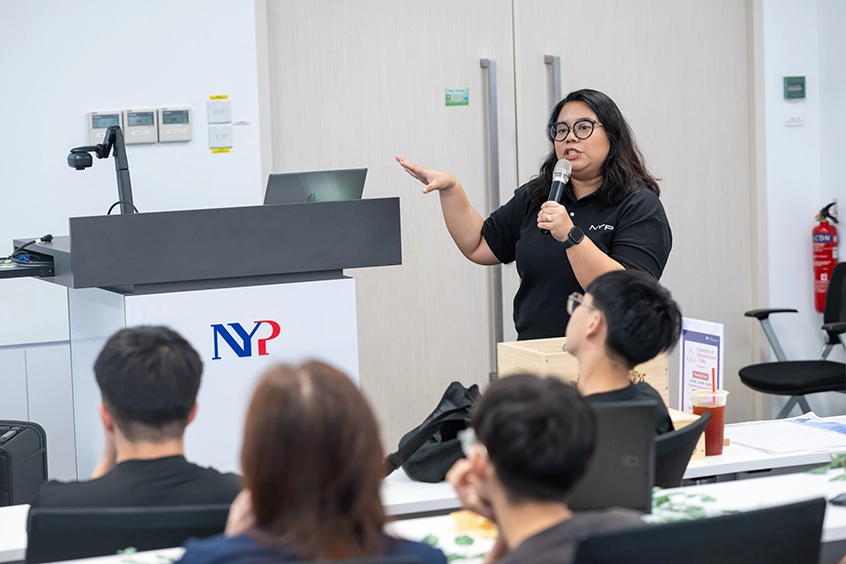 A NYP lecturer speaking to an audience.