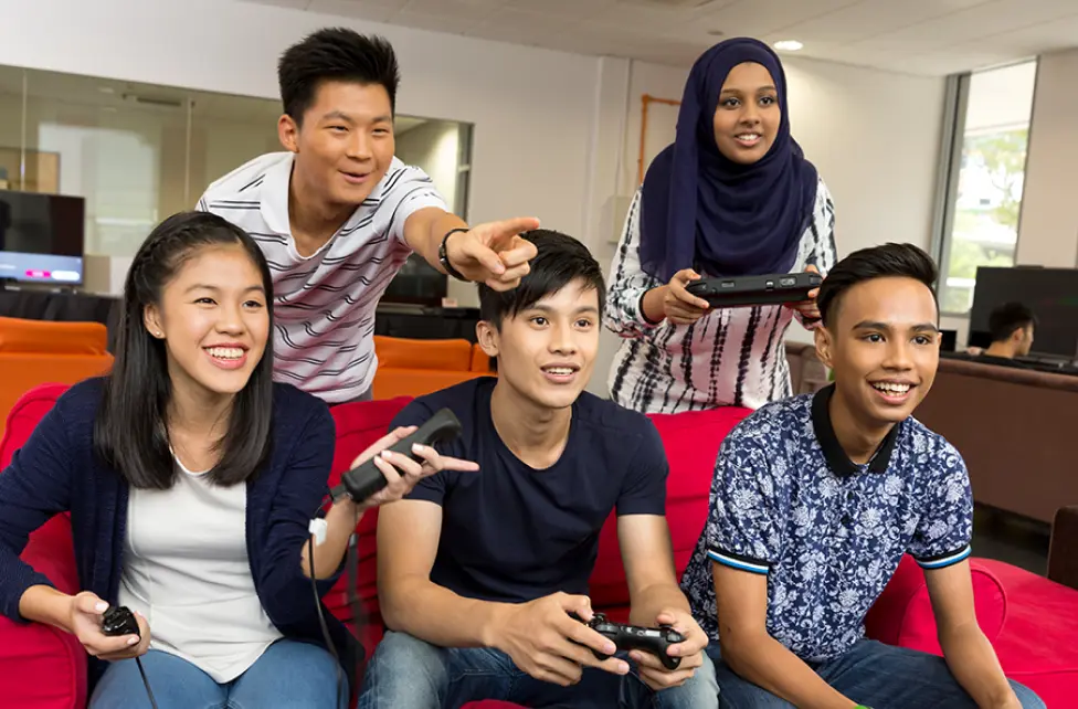 Students playing console games together