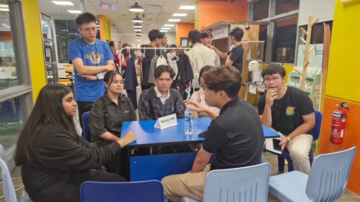 People sitting around a table in deep conversation.