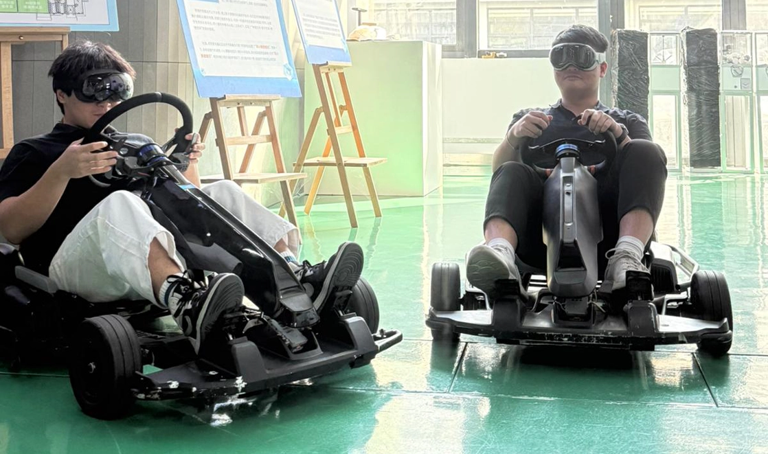 Jun Han and his friend trying out new racing cars.