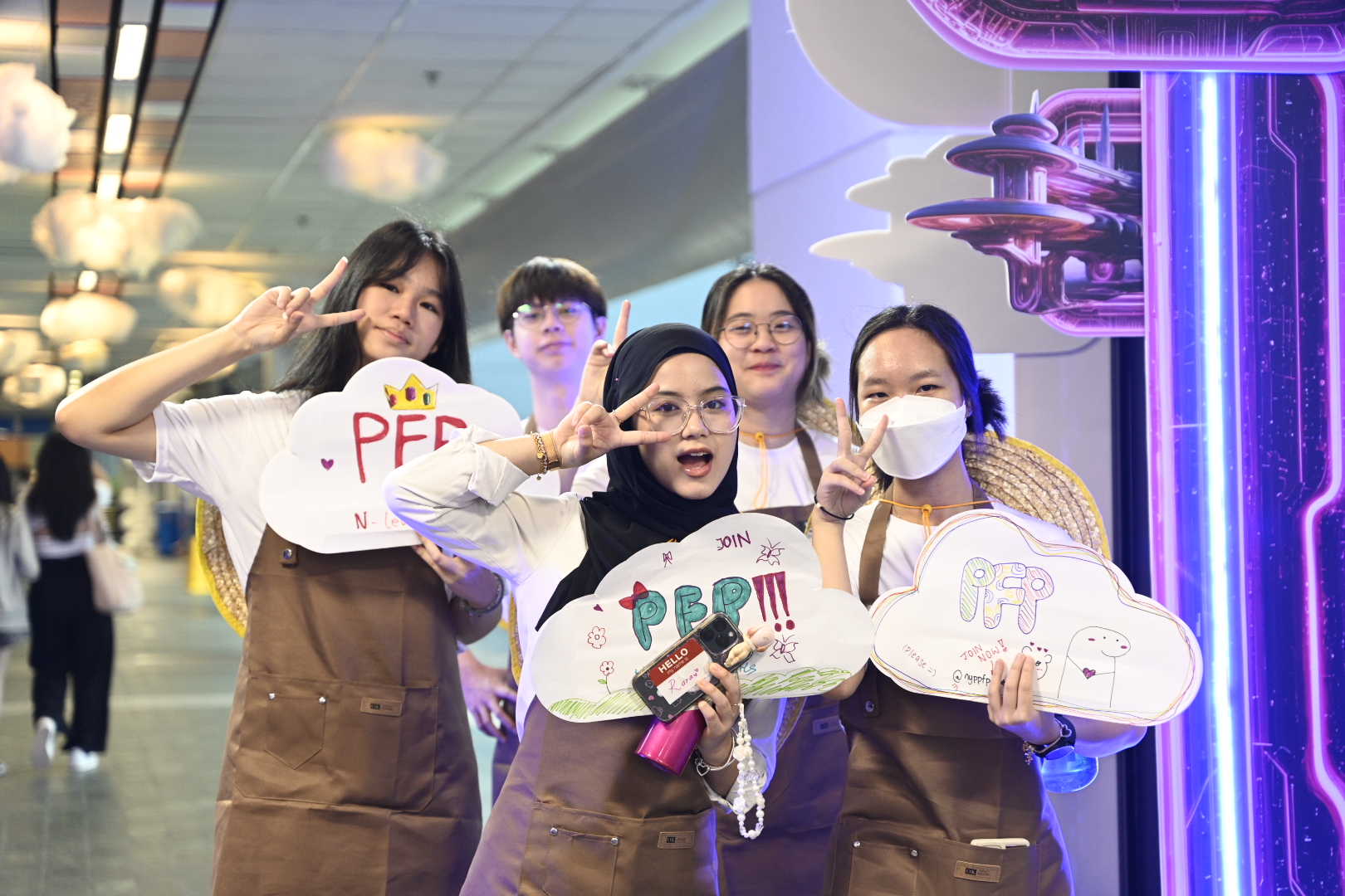 Woman wearing a tudong and putting on a wide smile