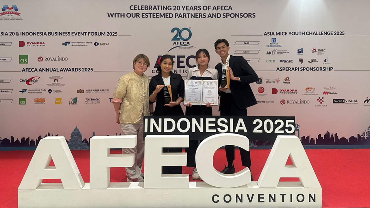 Students from the DHTM team on stage holding their trophies at AFECA 2025 in Jakarta, Indonesia.