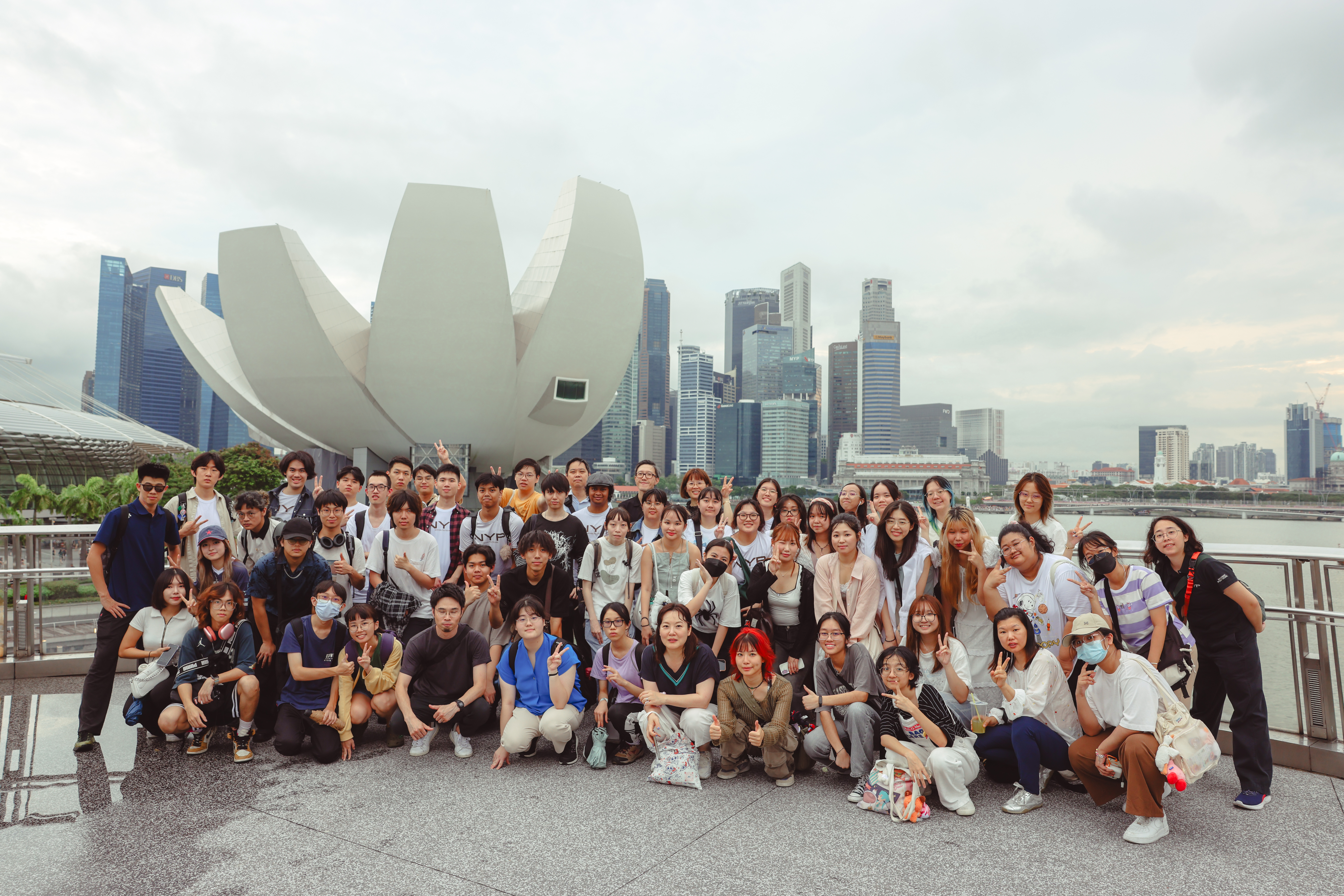 IGCC 2025 participants from eight institutions gathered by the Singapore River.