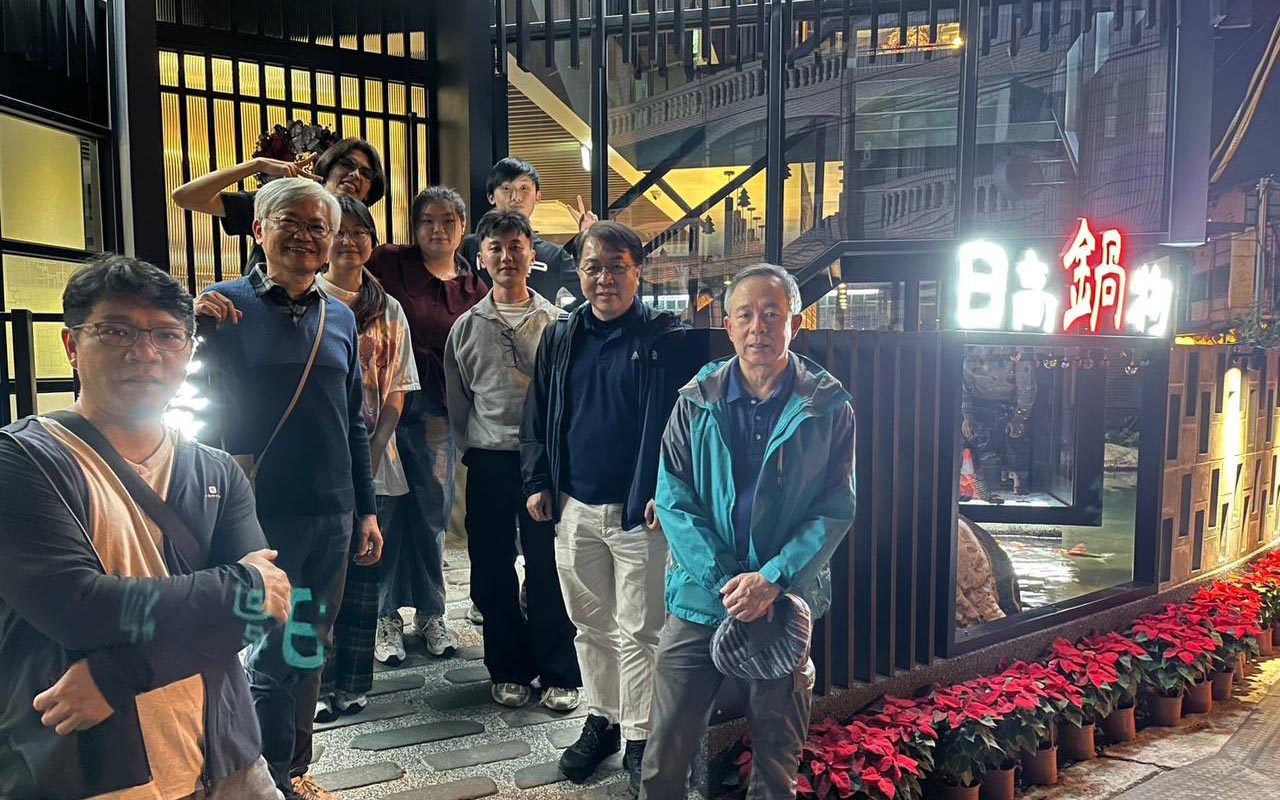 Dobry and Douglas with their professors and fellow interns.