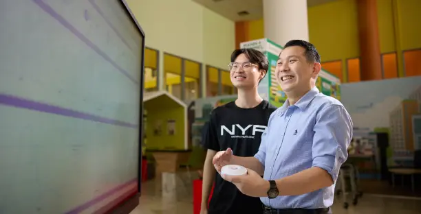Lecturer and student looking into the background